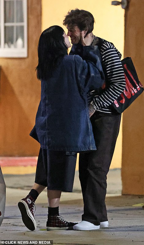 Smitten: The American singer shared a kiss with Rutherford following a dinner date at Studio City restaurant La Mirch, from where she had posted a series of photos capturing the couple as they enjoyed an Indian meal