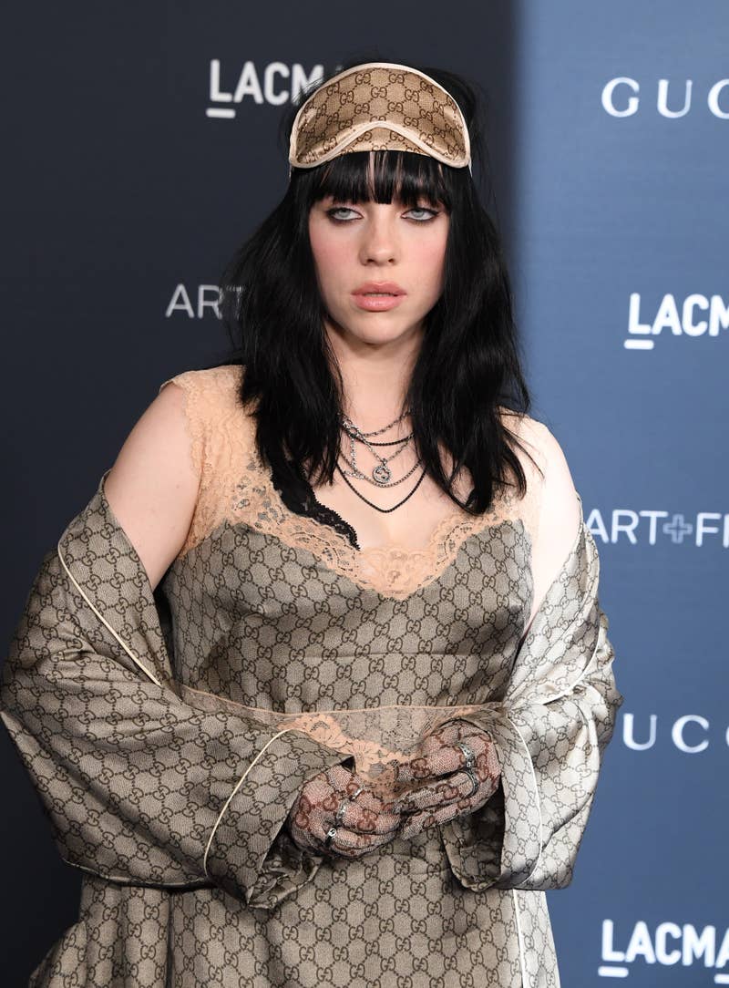 Close-up of Billie with long, dark hair at a media event