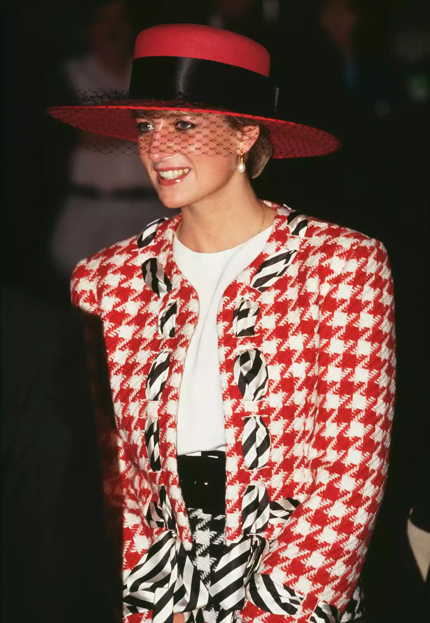 Diana, Princess of Wales (1961 - 1997) arrives at Toronto airport for an official visit to Canada, 23rd October 1991. She is wearing a red, white and black Moschino suit and a hat by Philip Somerville