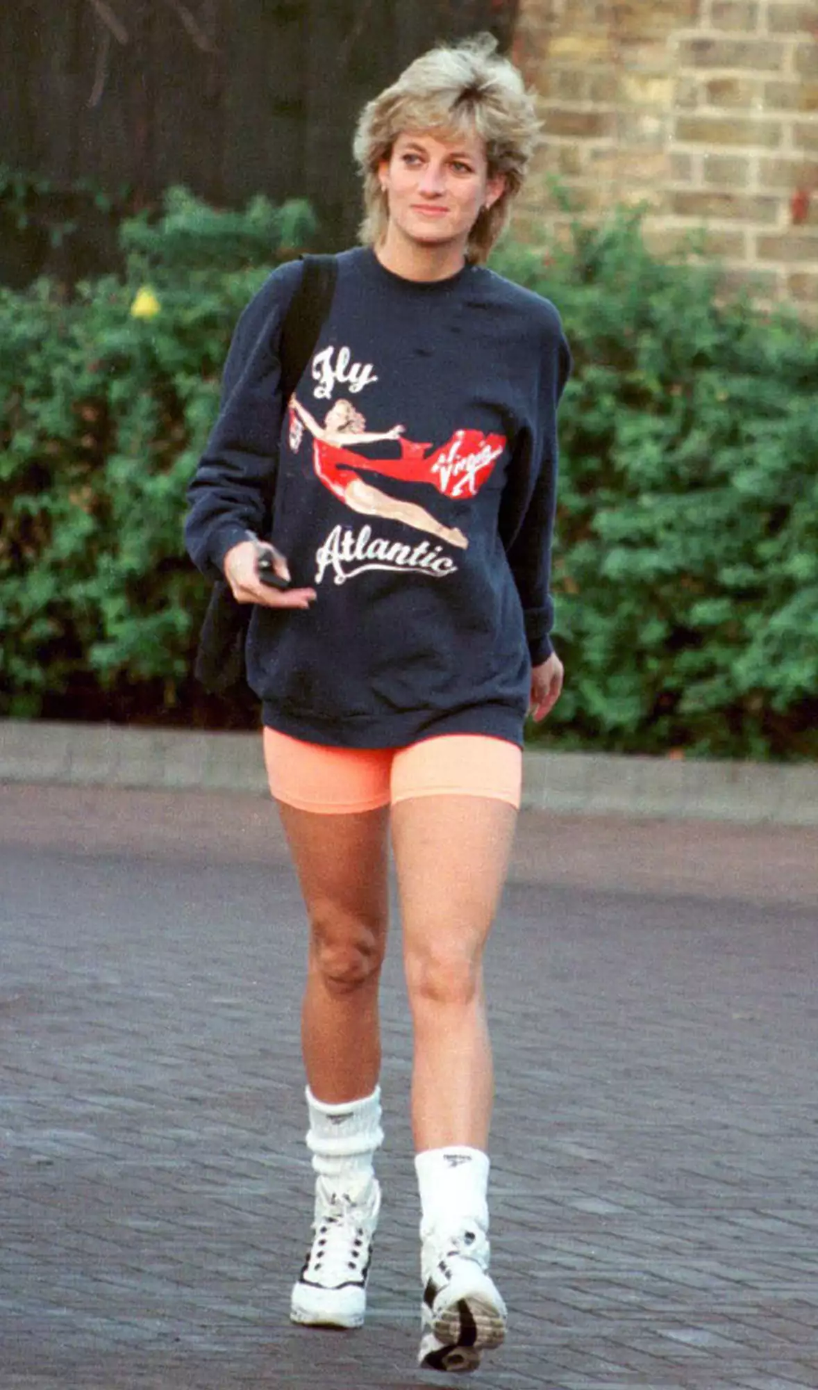 Princess Diana, Princess of Wales, wearing Virgin Atlantic sweatshirt, leaves Chelsea Harbour Club, London in November, 1995
