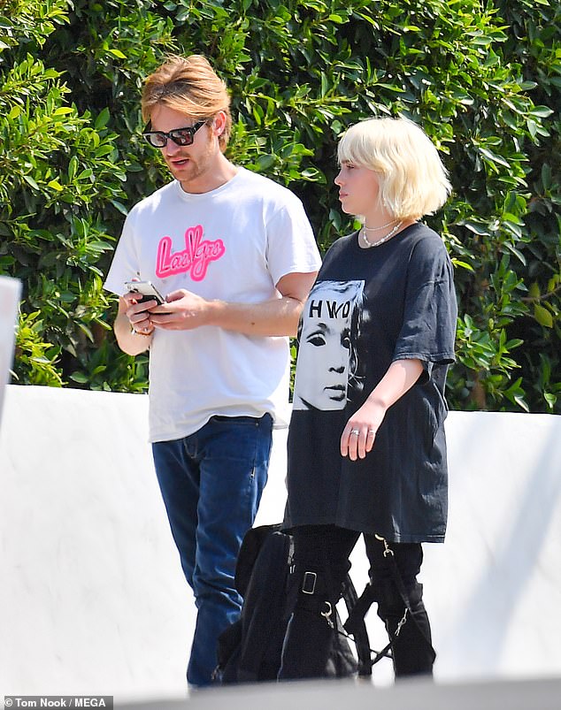 Easy: Opting for a more relaxed look hearkening back to her early days, Billie donned a baggy tee shirt from Rob Kardashian's Halfway Dead clothing line