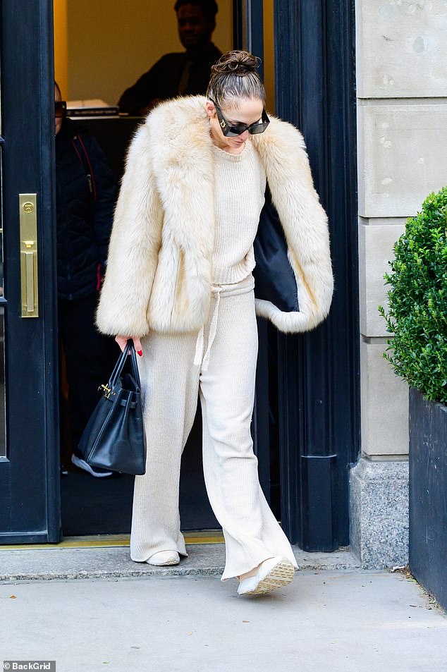Jennifer Lopez braves the cold in a glamorous fur coat over cozy beige sweats while stepping out in NYC | Daily Mail Online