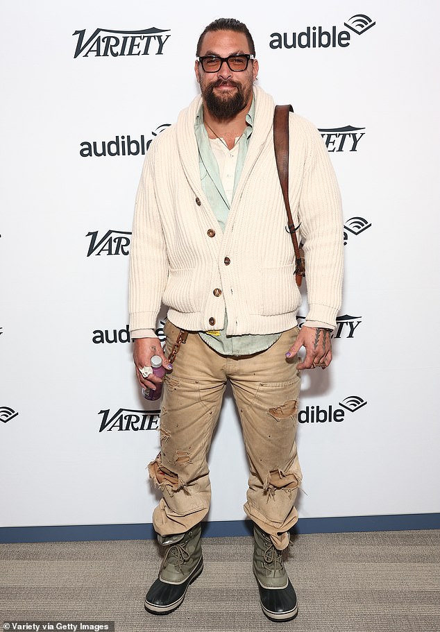 Extra cozy: Jason Momoa donned a chunky white cardigan while at the Variety Sundance Studio on Friday