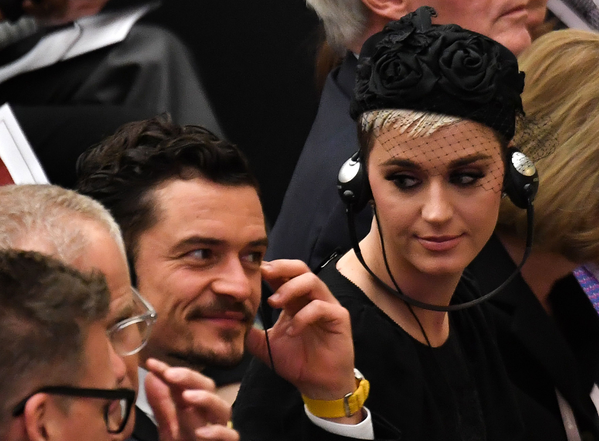 Katy Perry and Orlando Bloom sitting next to each other