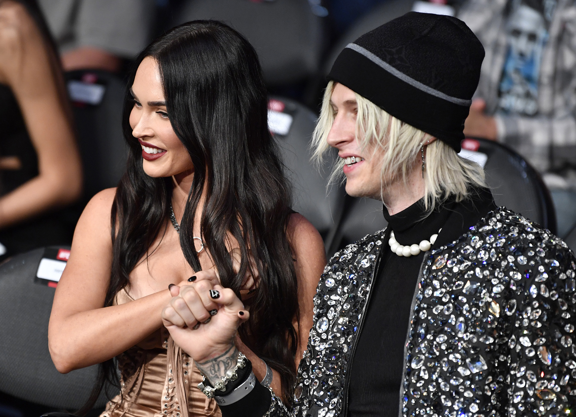 Megan Fox and Machine Gun Kelly are seen in attendance during the UFC 264 event