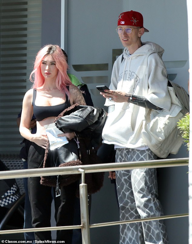 The mother-of-three wore her pastel pink tresses in a straight style, cascading down her back