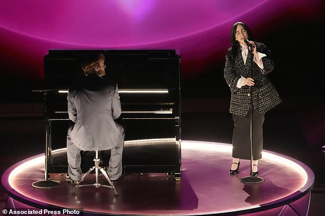 Finneas, left, and Billie Eilish perform "What Was I Made For?" from "Barbie" during the Oscars on Sunday, March 10, 2024, at the Dolby Theatre in Los Angeles. (AP Photo/Chris Pizzello)