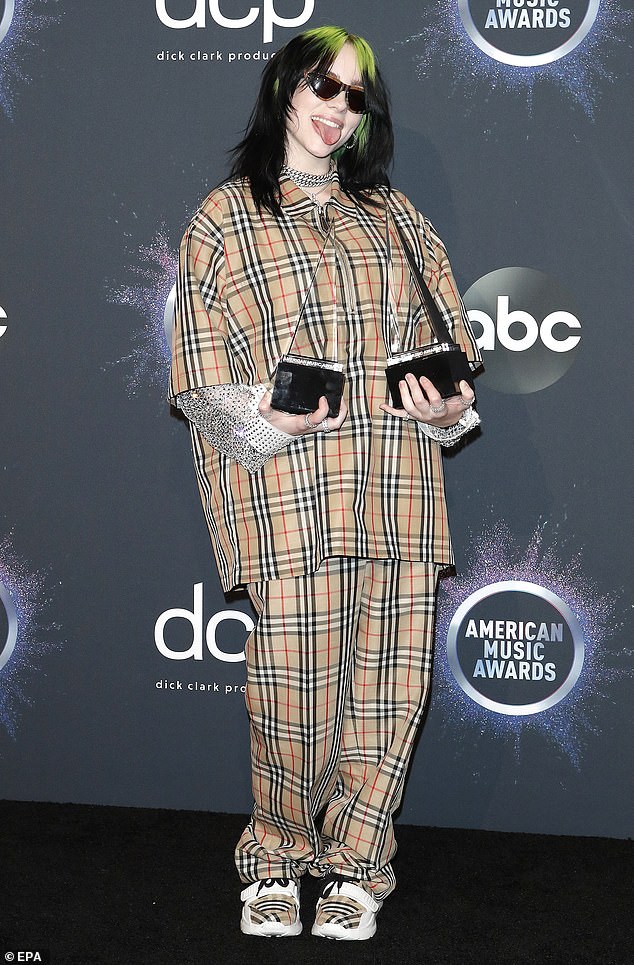 Winner: The singer is spotted posing with her awards at the American Music Awards a few days back