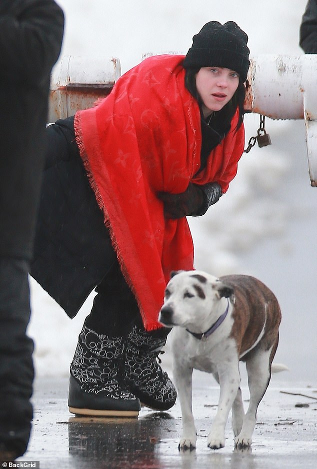 Stylish: The Bad Guy singer completed the look with a pair of thick black boots with white designs on them