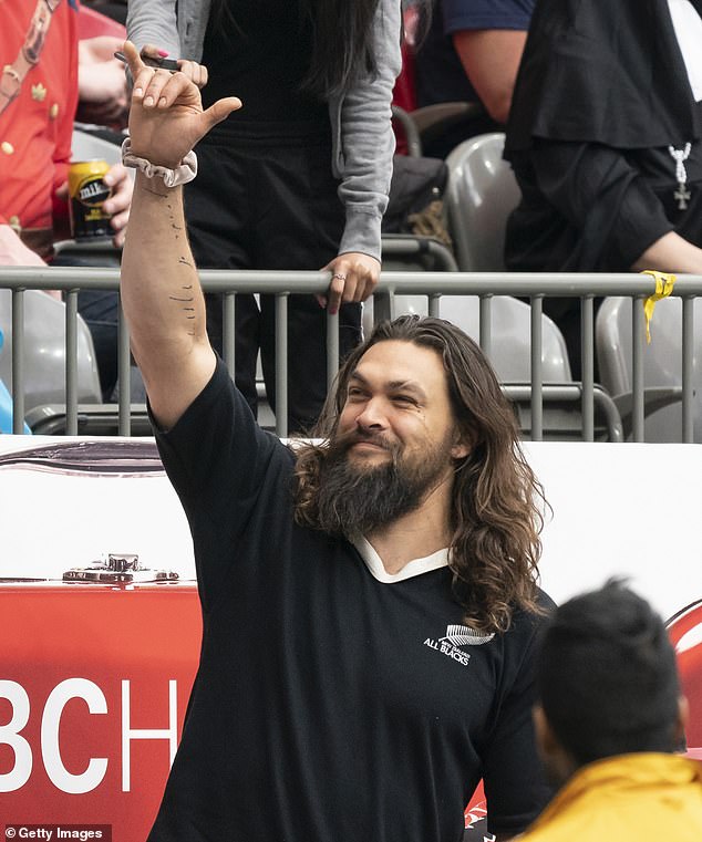 Victory: Jason Momoa, 39, was at the World Rugby Sevens Series game action in Vancouver, British Columbia, Sunday, where he cheered on New Zealand's All Blacks Sevens in their match against Argentina Pumas at the BC Place