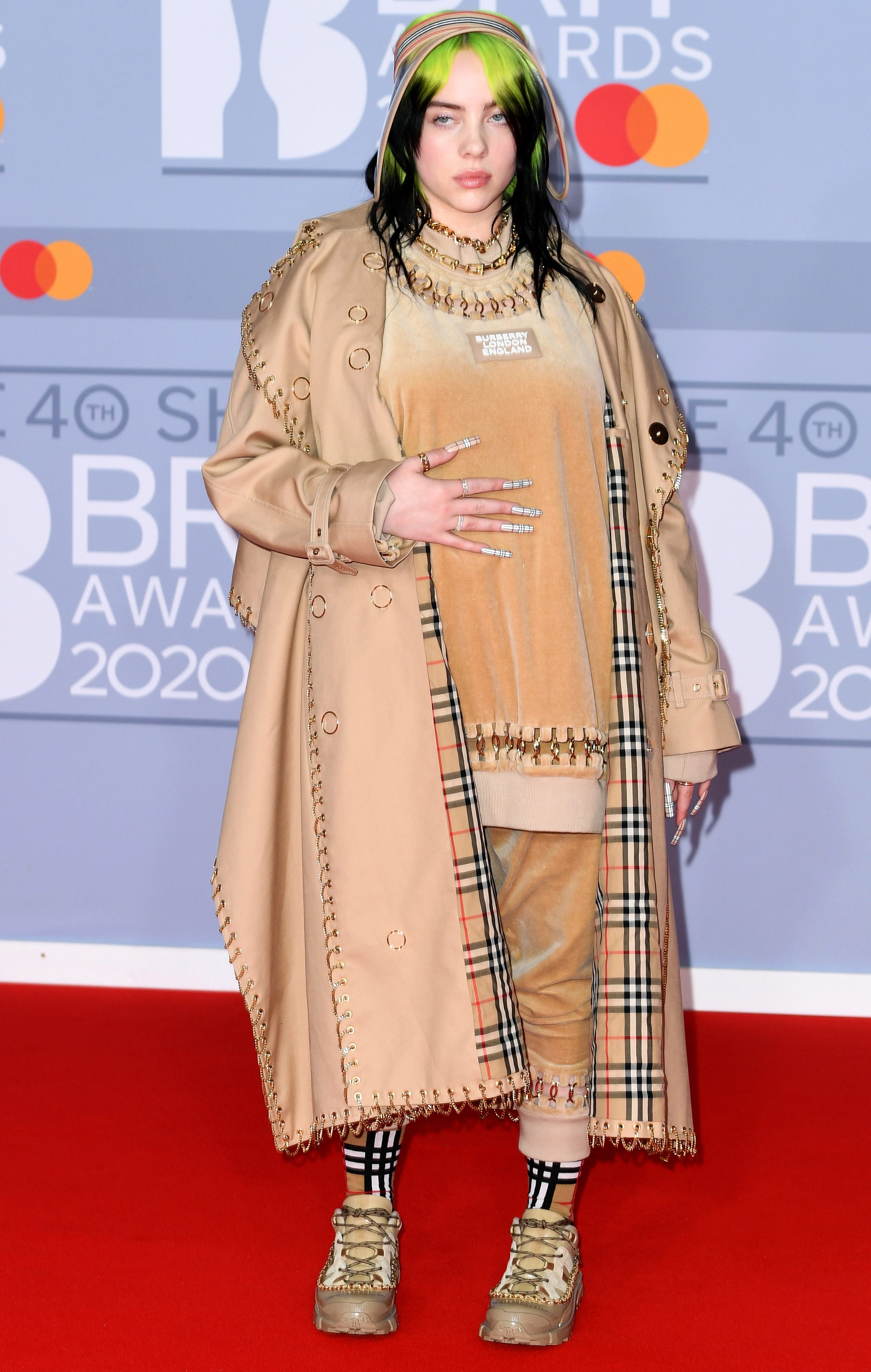 Billie gave her usual moody stare as she posed on the Brit Awards 2020 red carpet