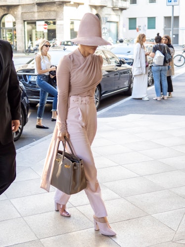 Jennifer Lopez in a big hat and Birkin.