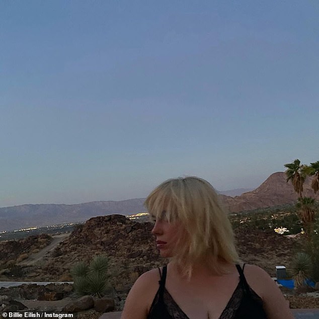 Billie at sunset: The hitmaker was seen in a black top with her blonde hair down