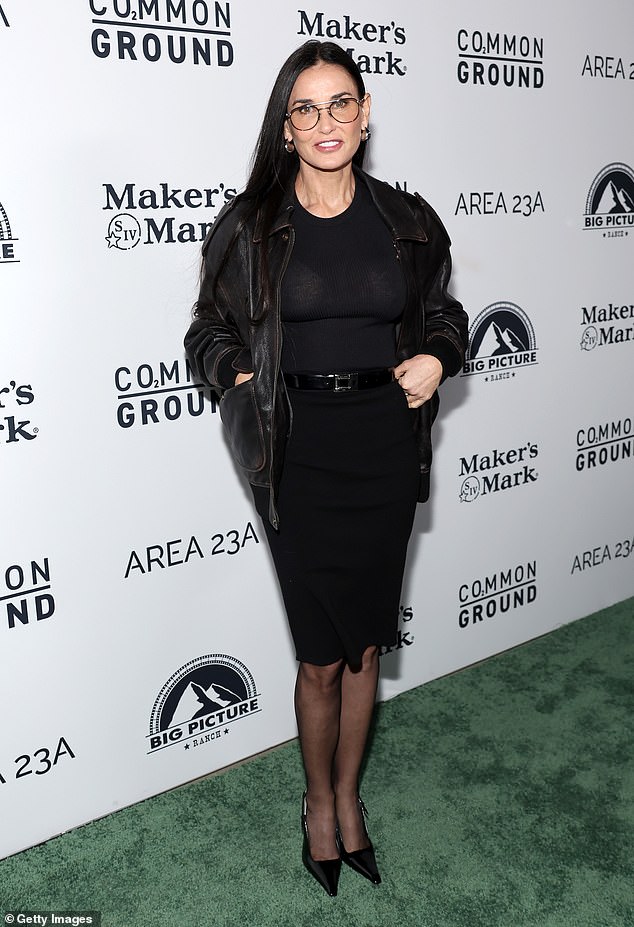 Moore, 61, looked incredible as ever in a black tee tucked into a matching pencil skirt. She braved the chilly nighttime weather in a black leather jacket
