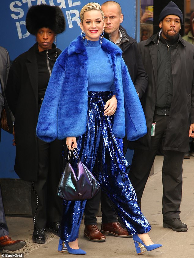 A total babe in blue: Katy Perry turned heads as she strolled through New York after an interview on Good Morning America early on Wednesday