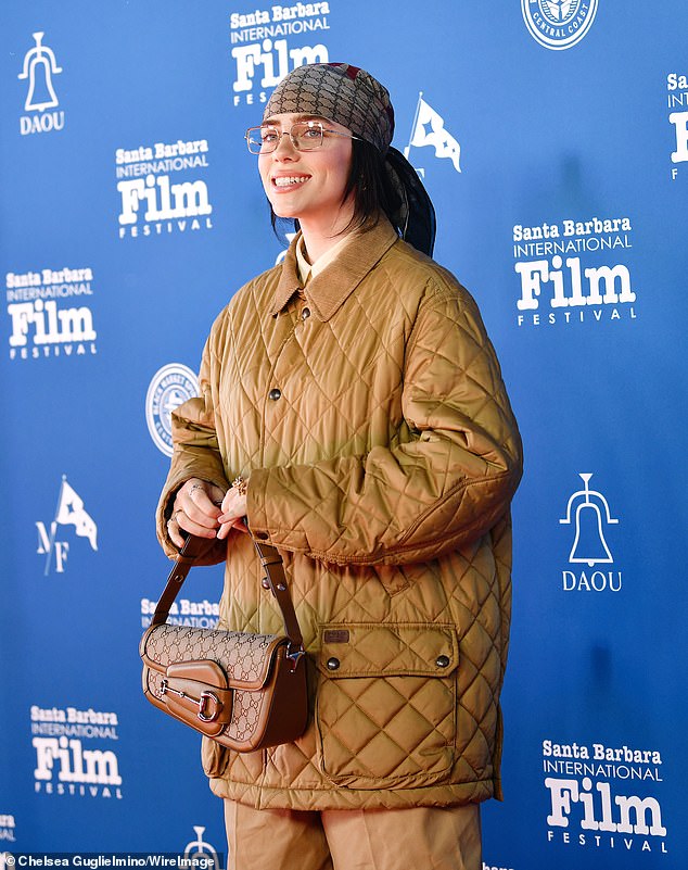 Billie - who gets 67.3M monthly listeners on Spotify - toted the $3,200 'Horsebit 1955 Small Shoulder Bag'