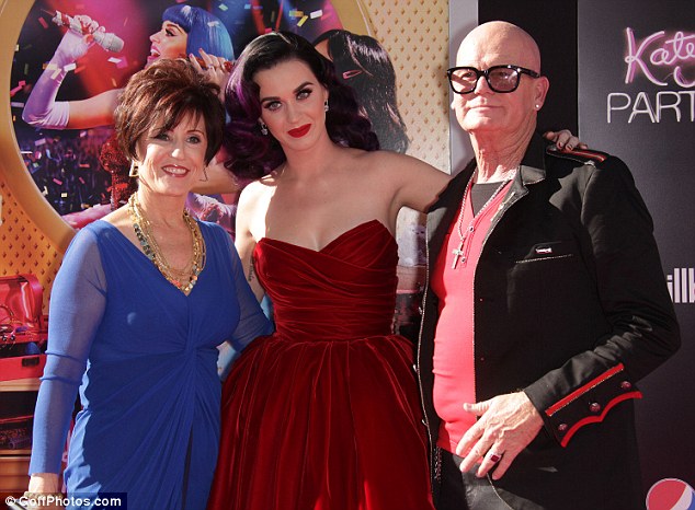 Phew: Katy Perry, pictured here with parents Keith and Mary Hudson, has revealed her mother praises God every day for her divorce