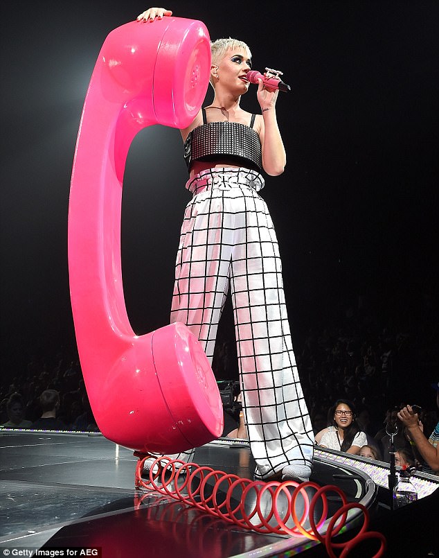 Calling Katy! The pop star shimmied next to a supersized pink phone