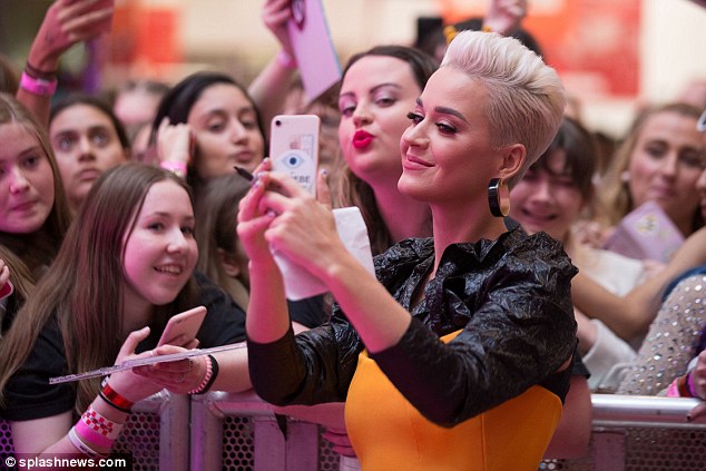 Say cheese! Taking time for her fans on the way into the venue, the Firework hitmaker stopped to take selfies with the hordes of fans gathered at the venue