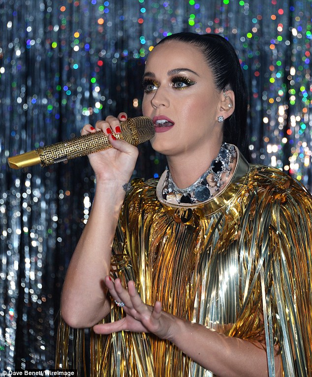 Scraping her hair back into the trademark high ponytail, her glittery make-up was heavily applied for maximum drama and was exacerbated by a brushed silver choker