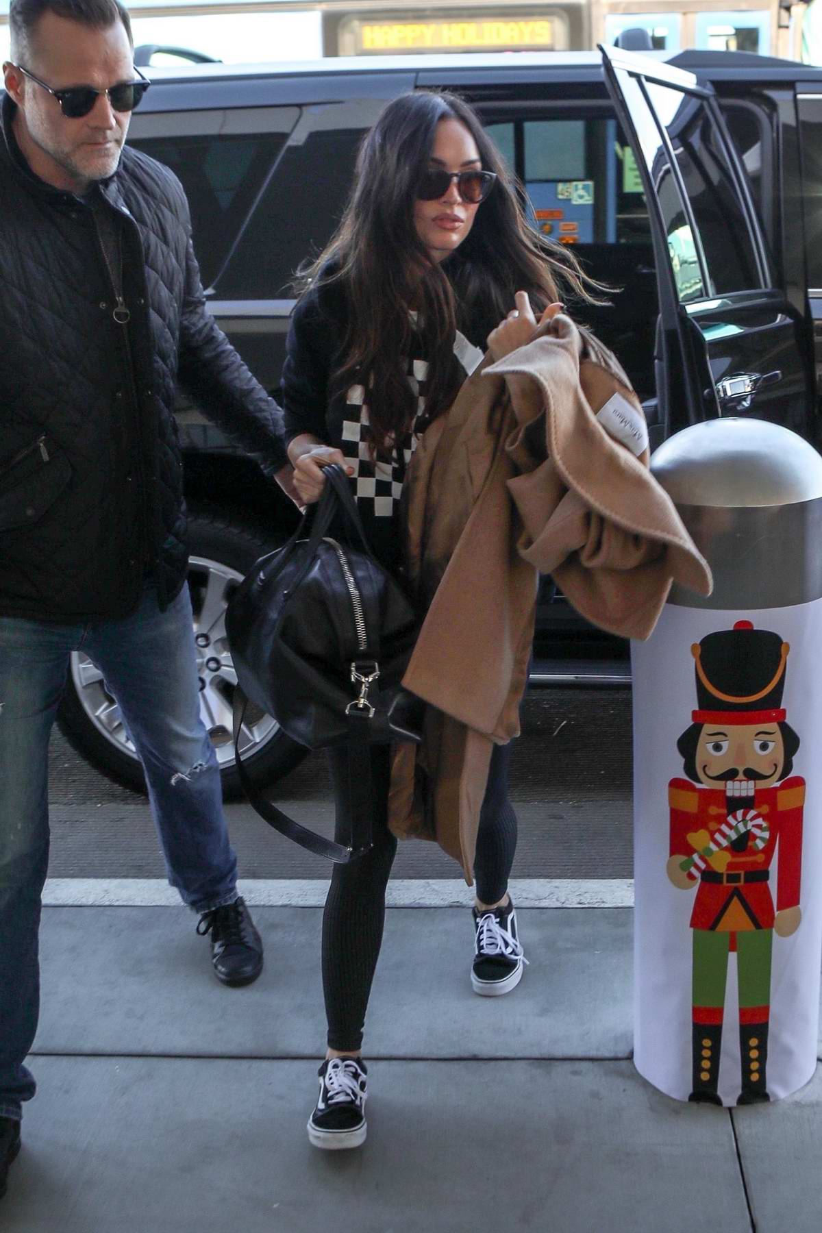 Megan Fox arrives to catch a flight out of LAX airport in Los Angeles