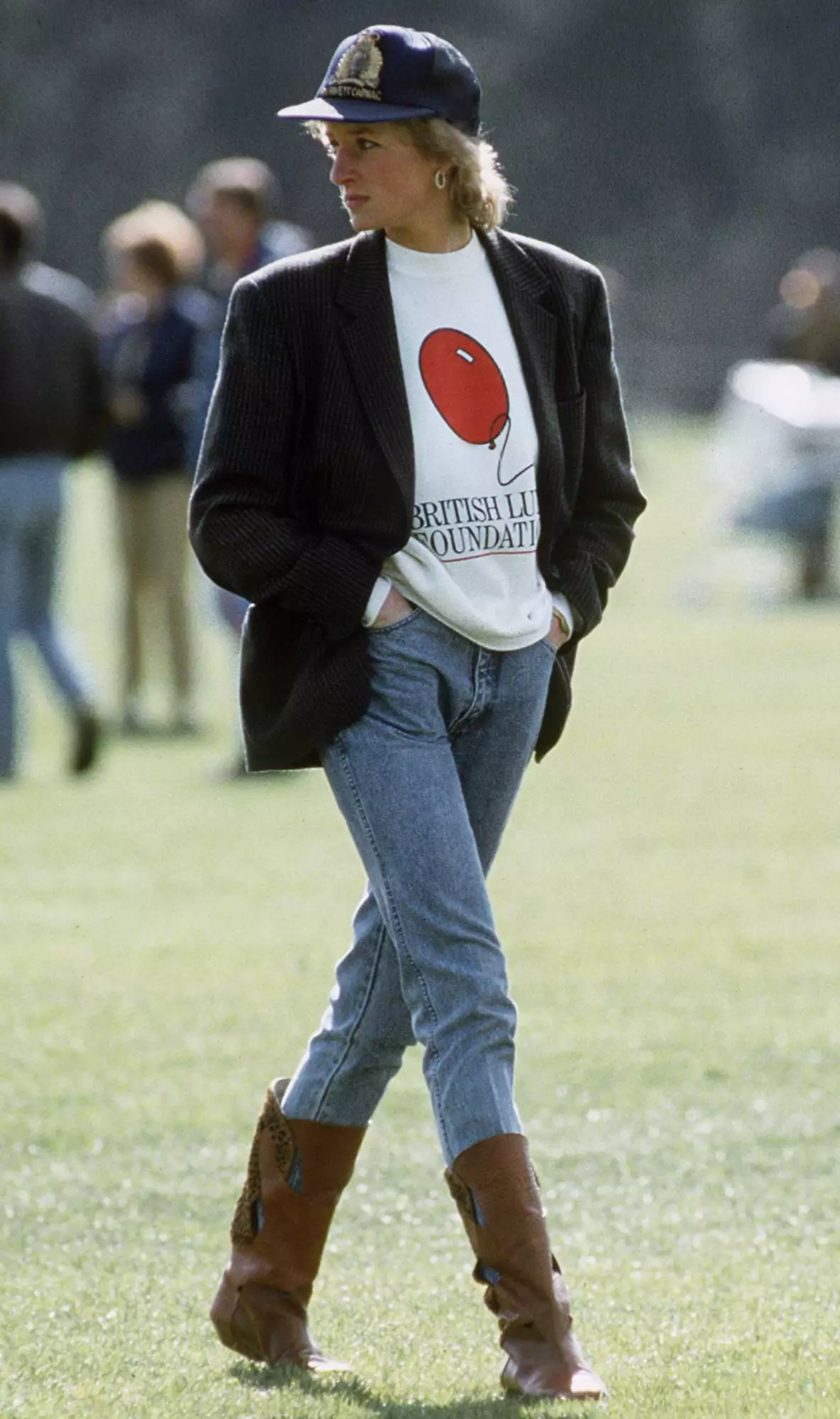 Diana, Princess Of Wales At Guards Polo Club. The Princess Is Casually Dressed In A Sweatshirt With The British Lung Foundation Logo On The Front, Jeans, Boots And A Baseball Cap