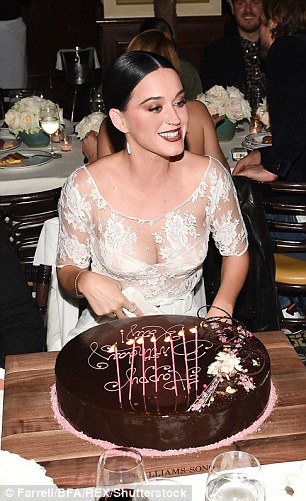 Chocolate treat: The star seemed overwhelmed as she blew out her candles