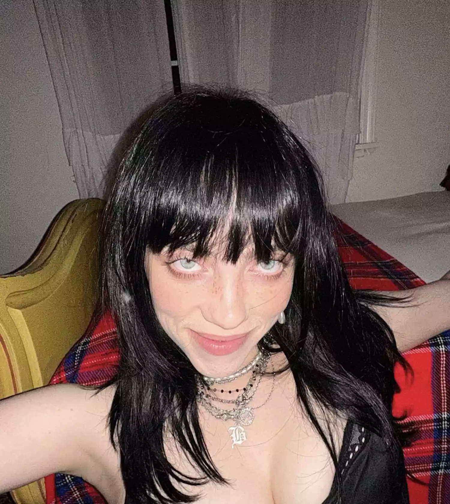 Billie Eilish with retro pinup bangs and shoulder length hair