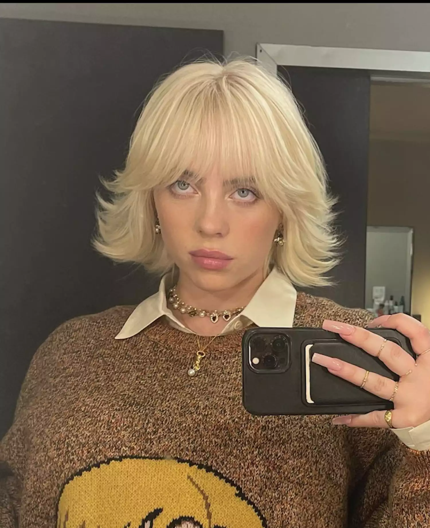 Billie Eilish in a 60s-style feathered bob