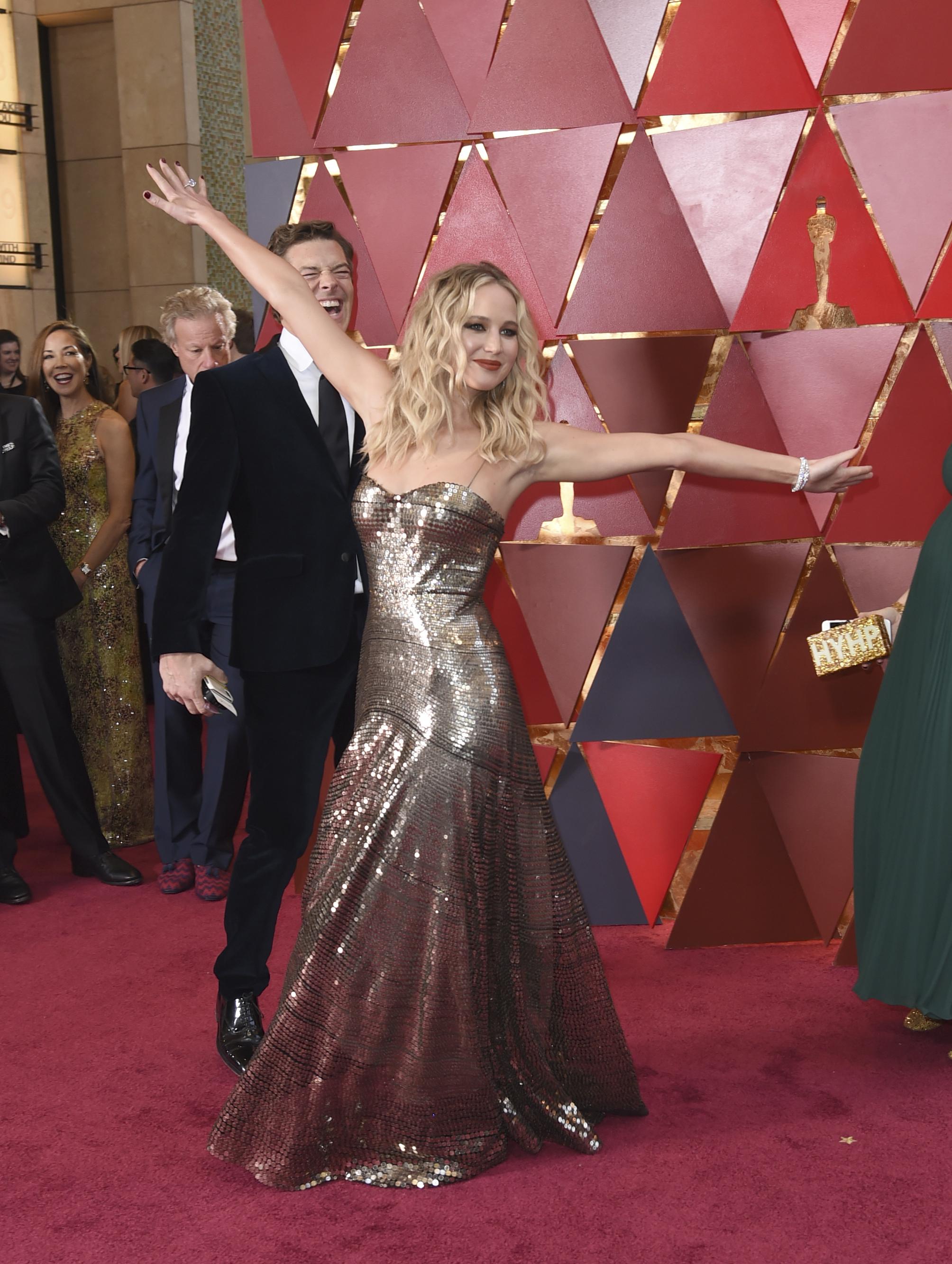 Jennifer Lawrence dances on Oscars 2018 red carpet as other big stars show off their outrageous poses | The Sun