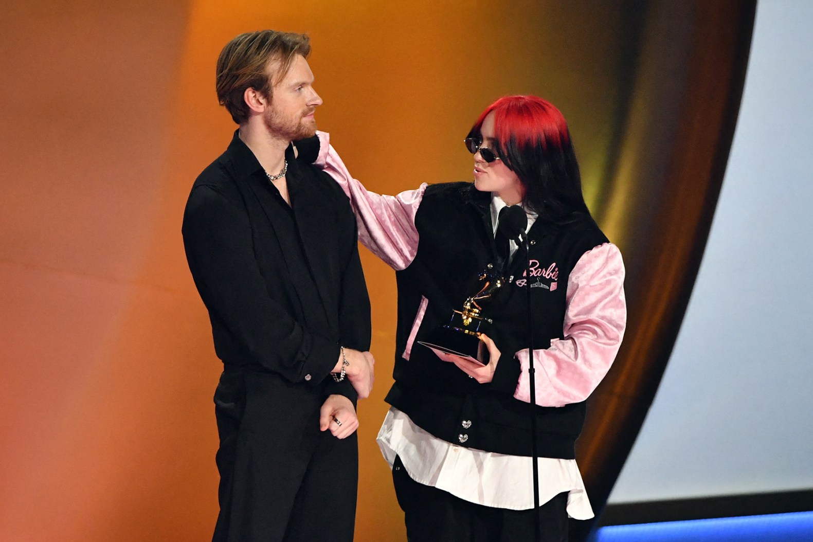 Billie Eilish (R) and US singer-songwriter Finneas O'Connell accept the Song Of The Year award for "What Was I Made For?" on stage during the 66th Annual Grammy Awards