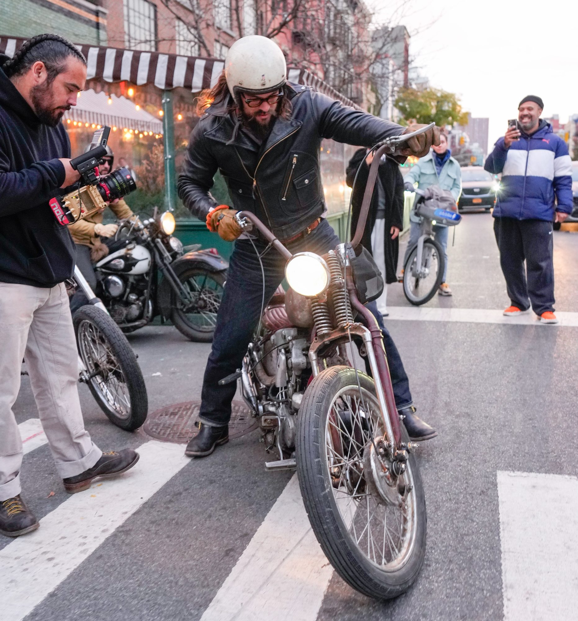 Jason Momoa rides a motorcycle on November 13 in NYC.