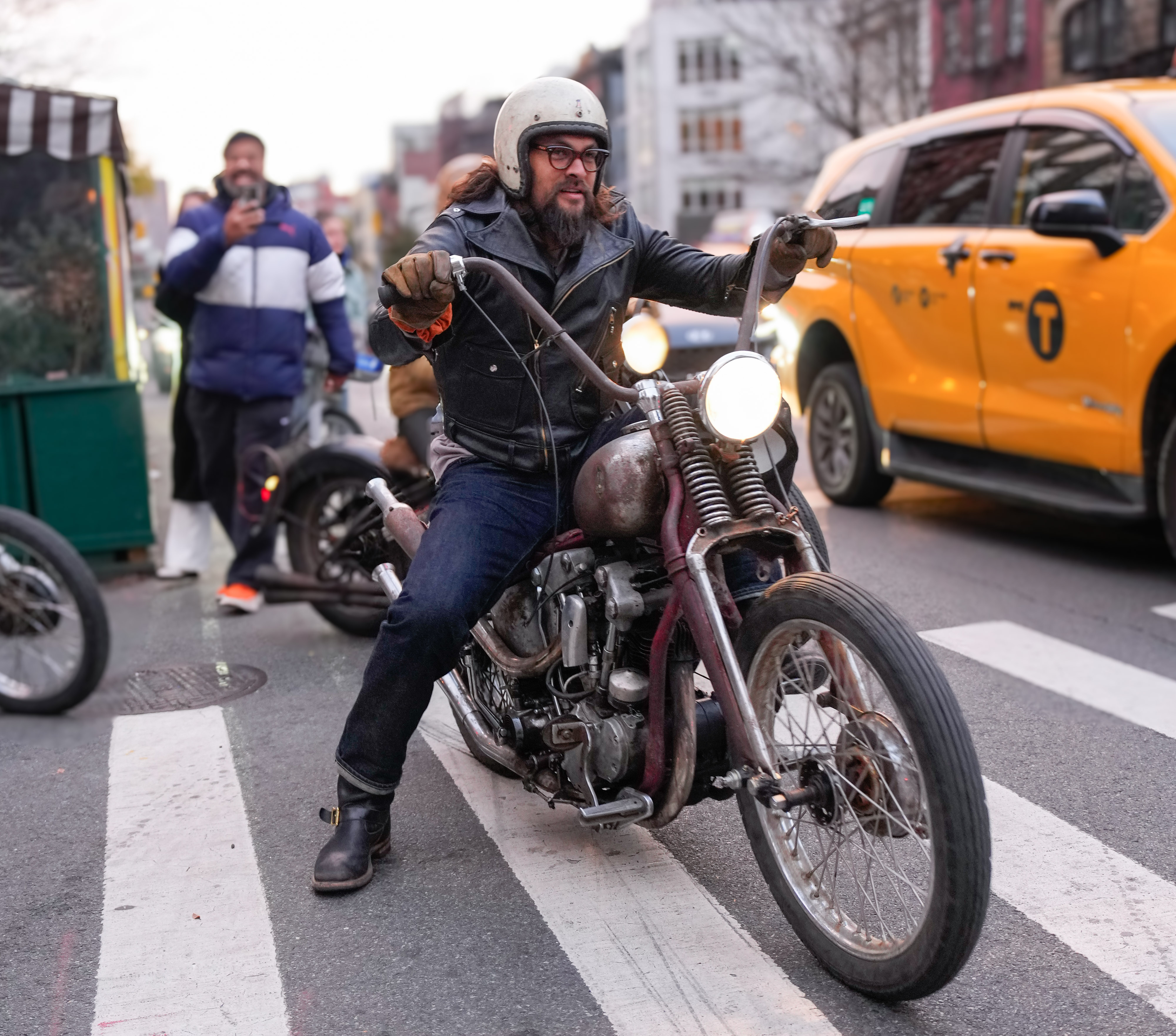 Jason Momoa rides a motorcycle on November 13 in NYC.