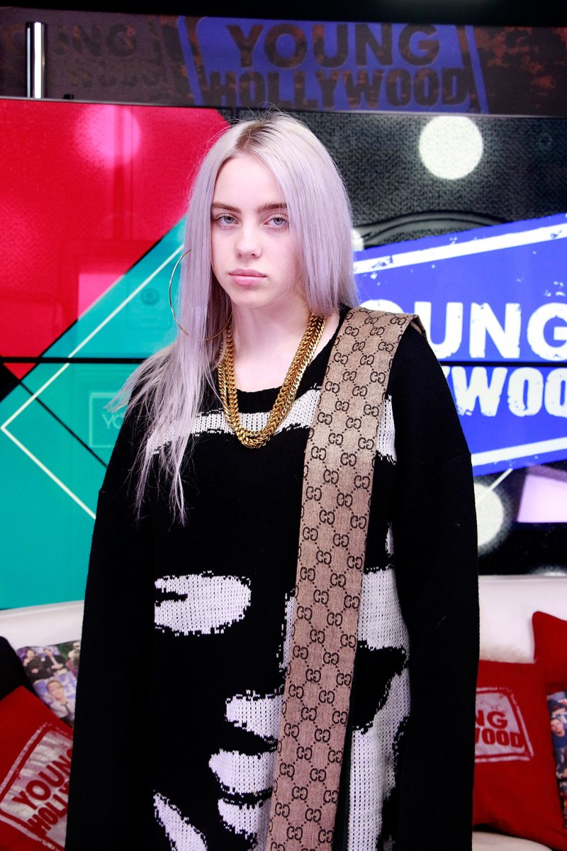 billie eilish with white hair and black oversized sweater