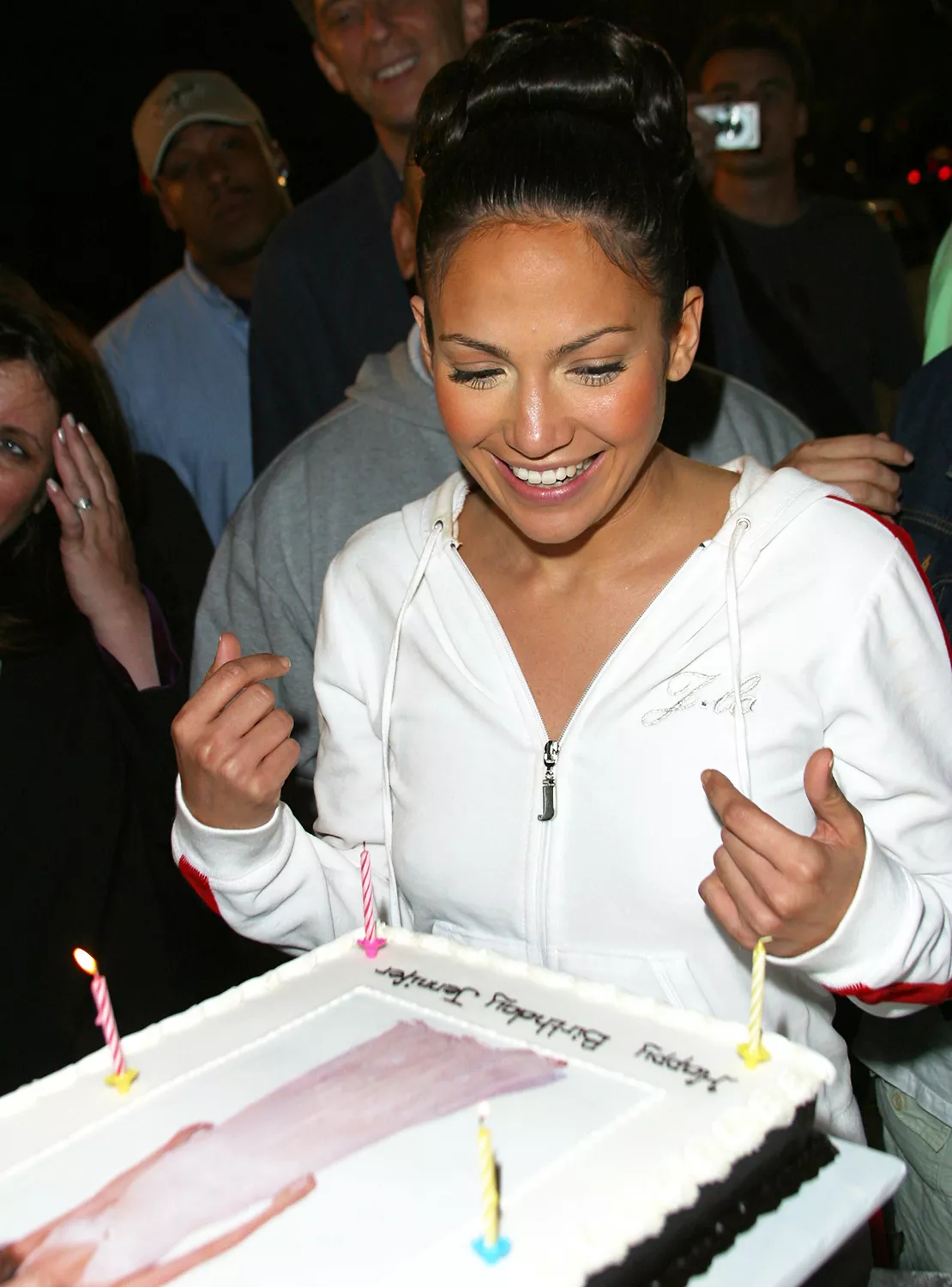 Jennifer Lopez checks out her birthday cake during Jennifer Lopez Celebrates Her 32nd Birthday On Location for Maid in Manhattan at Metropolitan Museum of Art in New York City.