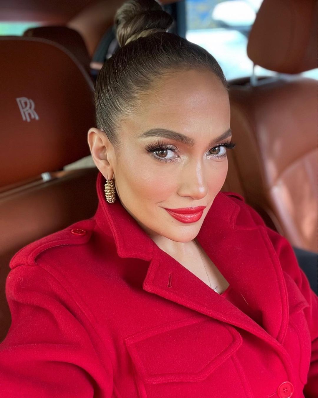 Jennifer Lopez red outfit selfie.