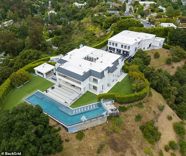 The 54-year-old beauty looked ready for a summer pool party as she sat in the backyard of the $60M mansion in Bel Air, California that she used to share with her husband Ben Affleck