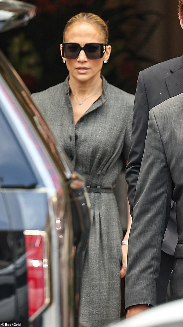 Jennifer Lopez cut a smart figure in a gray A-line dress as she stepped out in Los Angeles on Tuesday for lunch at the Mondrian Hotel