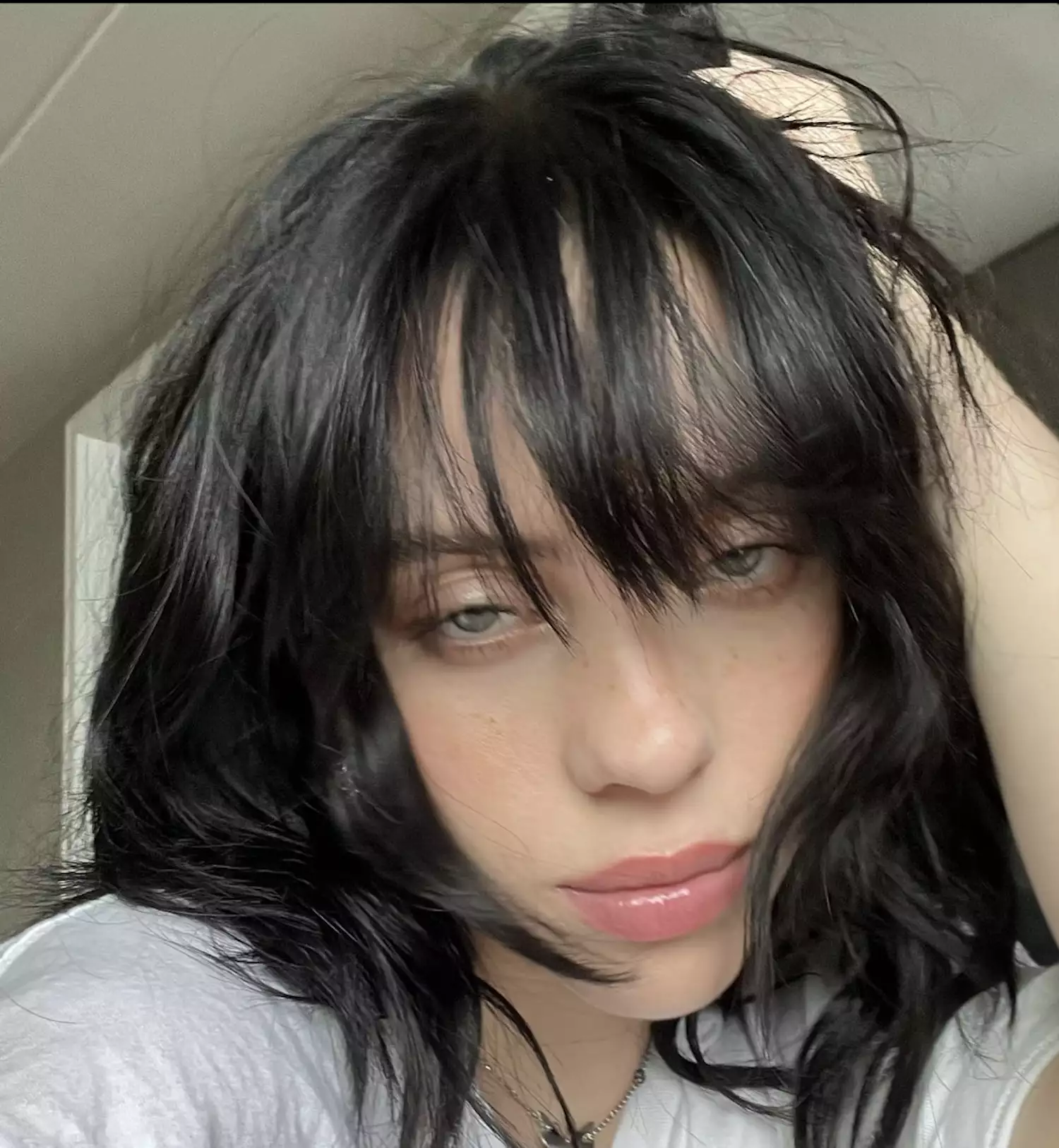 Billie Eilish in choppy hair with bangs