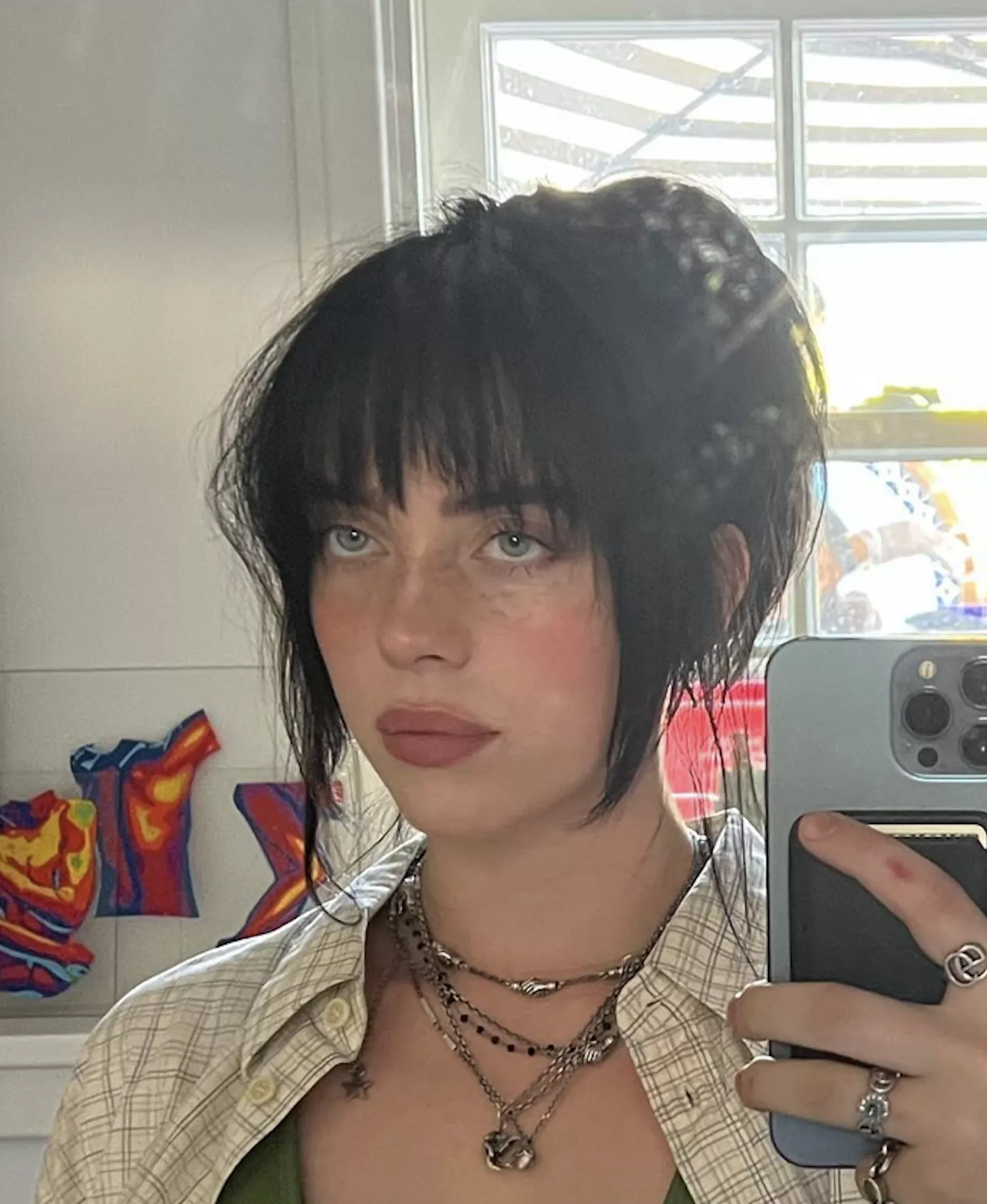 Billie Eilish in textured ponytail with bangs