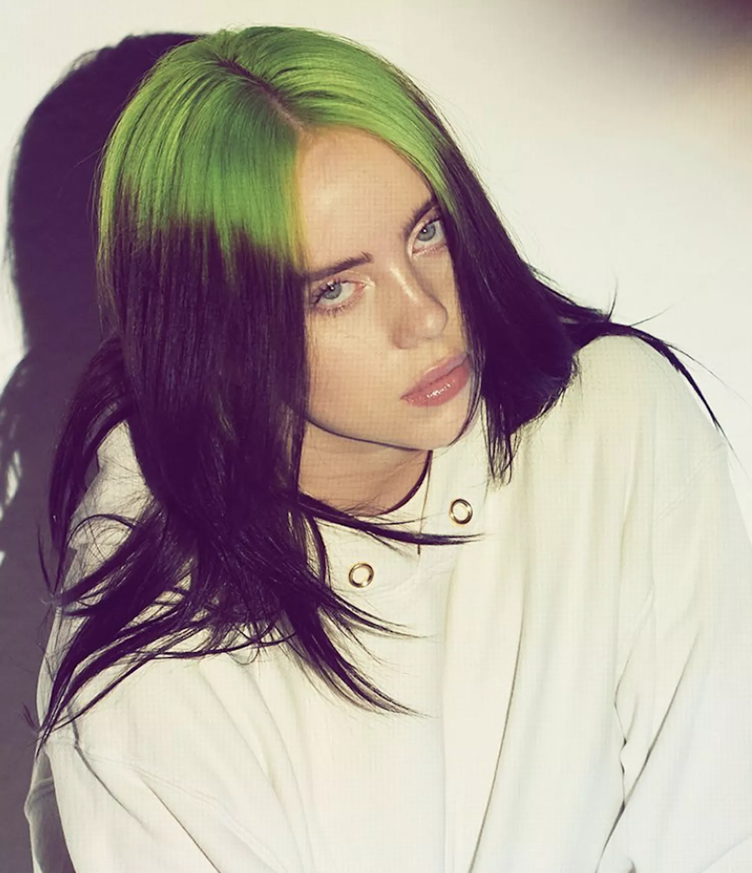 Billie Eilish with straight hair with Neon Roots