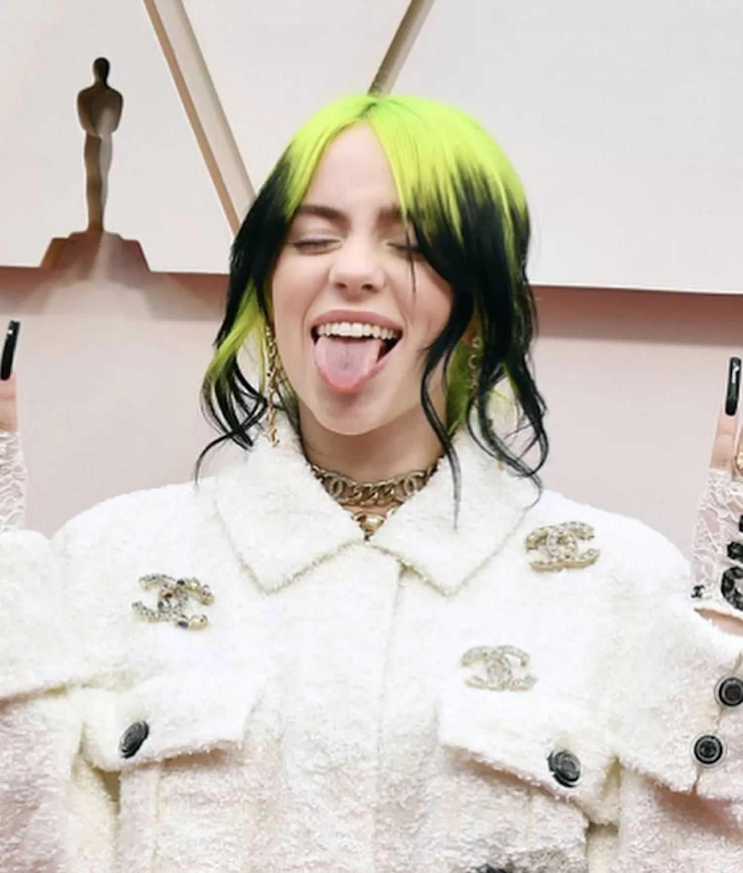 Billie Eilish with a two-toned updo with neon roots