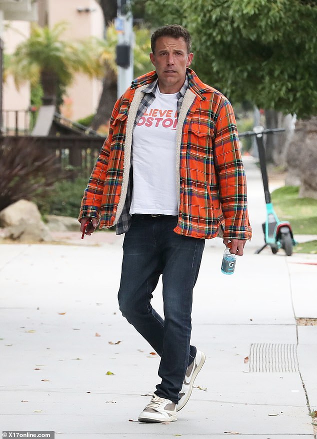 Ben also carried a colorful, plaid jacket as he left the big game and was later seen sporting the outer piece