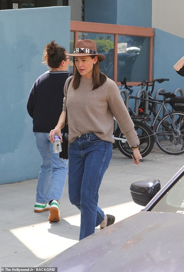 Jennifer Garner, 51, was clad in a casual ensemble on the weekend outing as she watched her son Samuel, 12, take part in a youth basketball game in Santa Monica, California Sunday